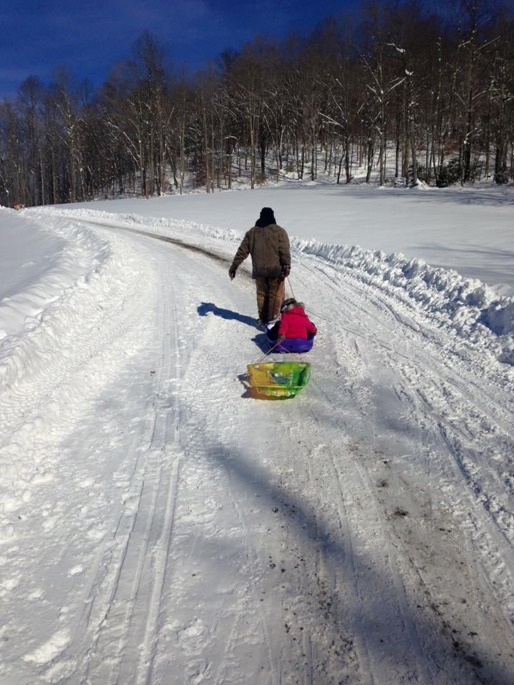 Sledding Fun for Everyone? For this faculty member's child, the snow provided a leisurely ride.